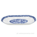 Placa oval de cerâmica azul e branca
